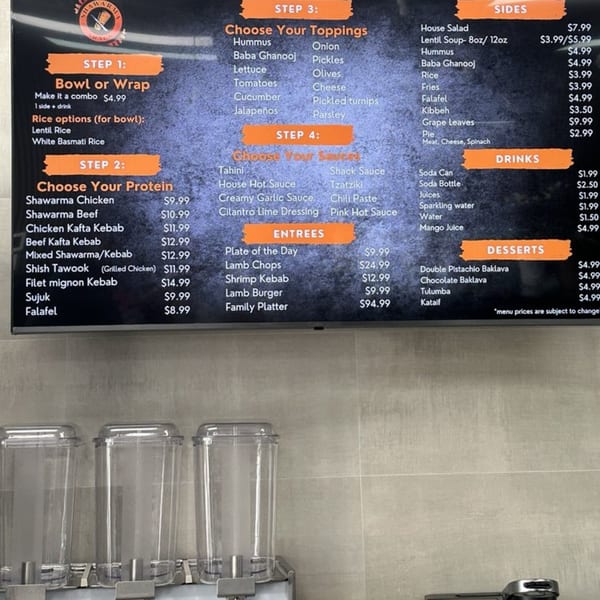 Shawarma Shack's menu board displays halal options for bowls, wraps, proteins, toppings, sauces, sides, drinks, entrees, and desserts.